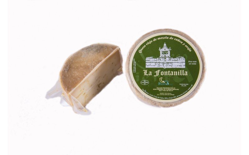 Queso de mezcla curado en aceite con su etiqueta circular verde